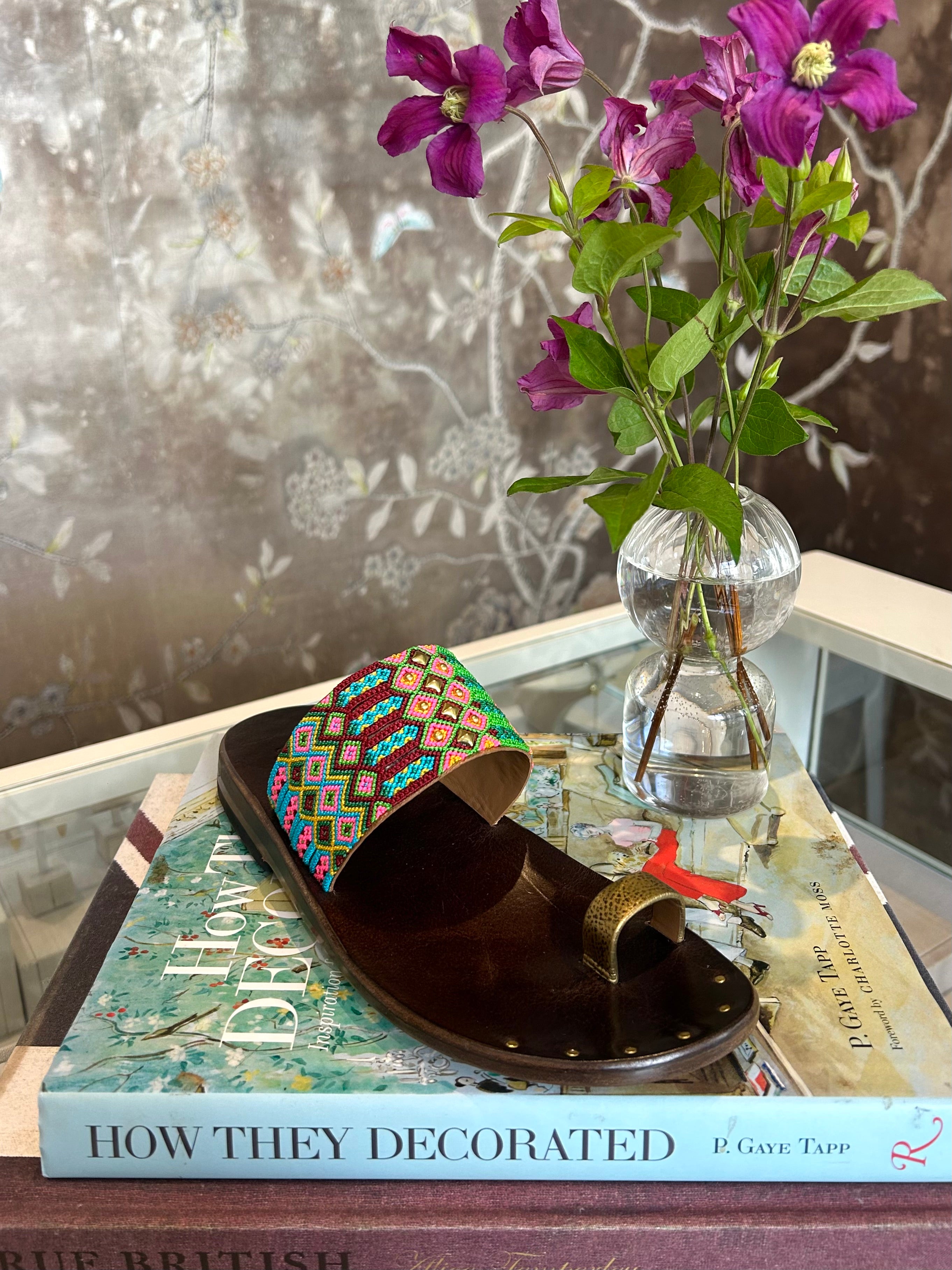 CALLEEN CORDERO | PAPI SANDAL | Multi-colored embroidered sandals | Hand crafted | Gold toe strap | Wide top-foot braided leather-lined strap | Hand-molded brown leather footbed with arch support | Rubber heel for easy walking | Charlotte, NC