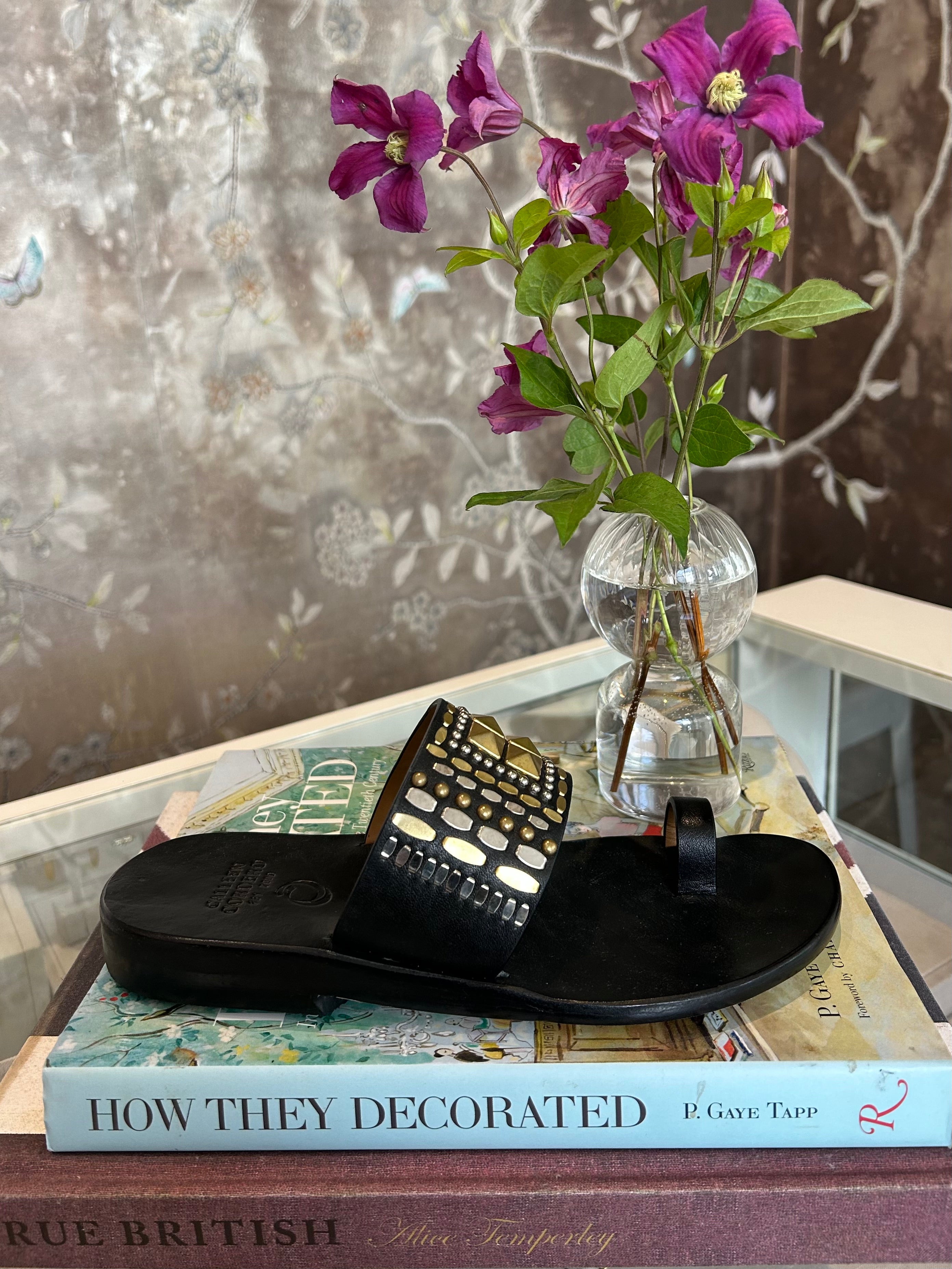 CALLEEN CORDERO | RENJI LEATHER SANDAL | Hand-crafted leather sandal | Brass and nickel hand-studded details | Single toe strap and over the foot strap | 
Full leather lined | Hand molded footbed, rubber heel | Available in Charlotte, NC