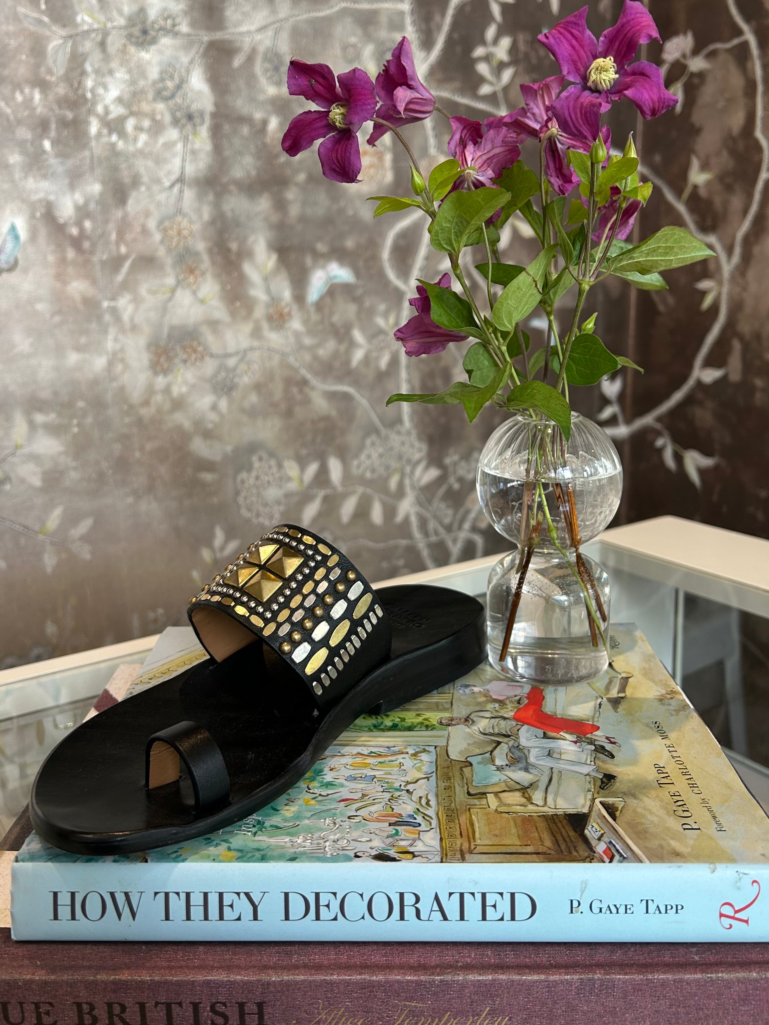 CALLEEN CORDERO | RENJI LEATHER SANDAL | Hand-crafted leather sandal | Brass and nickel hand-studded details | Single toe strap and over the foot strap | 
Full leather lined | Hand molded footbed, rubber heel | Available in Charlotte, NC