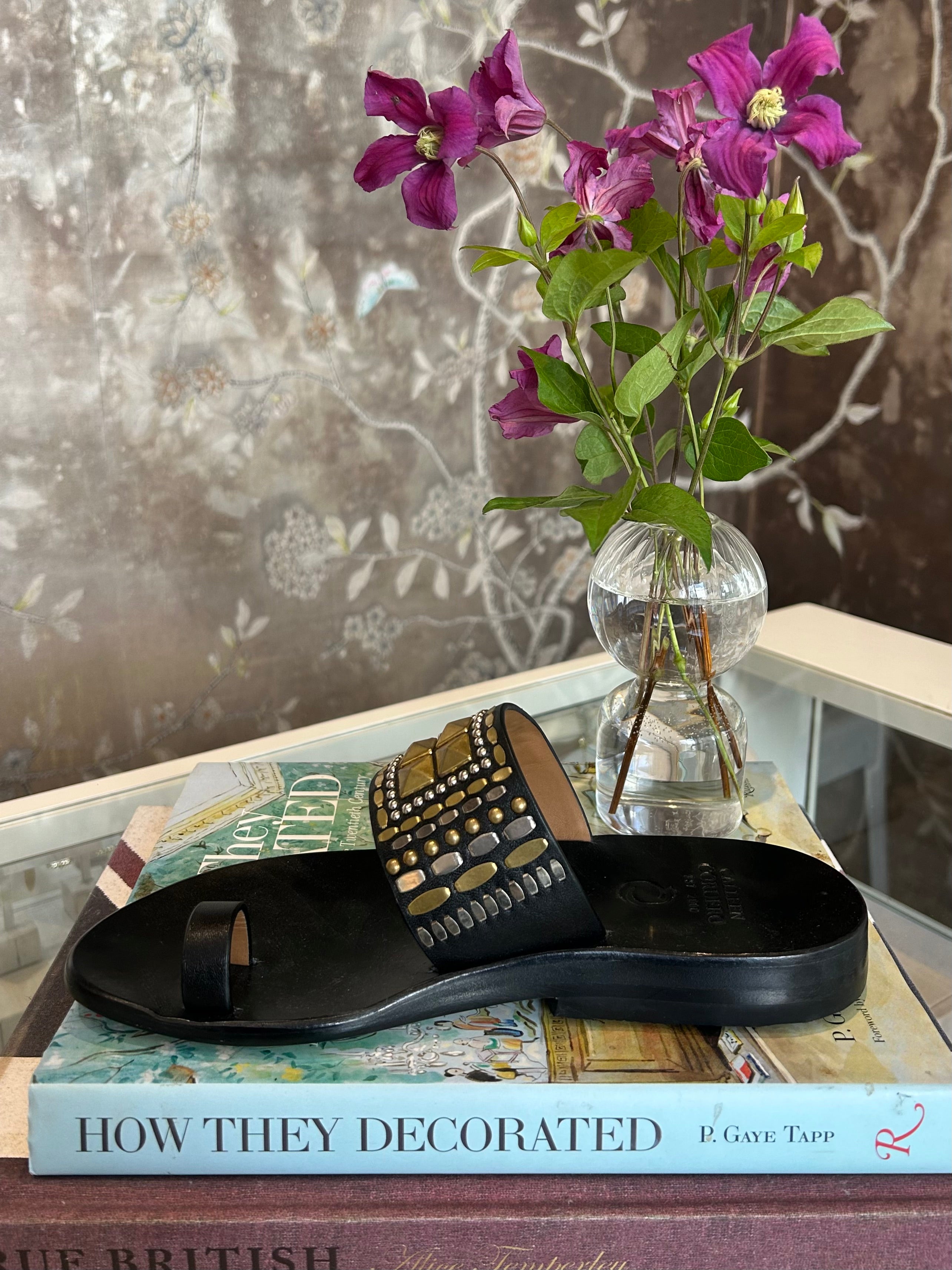 CALLEEN CORDERO | RENJI LEATHER SANDAL | Hand-crafted leather sandal | Brass and nickel hand-studded details | Single toe strap and over the foot strap | 
Full leather lined | Hand molded footbed, rubber heel | Available in Charlotte, NC