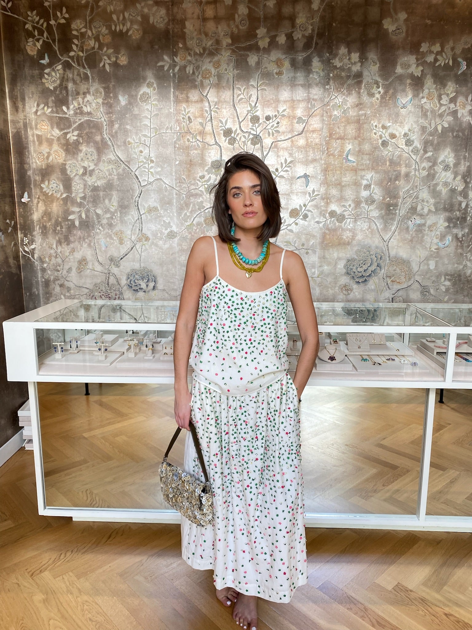 MII | EMBROIDERED MIDI SKIRT, Woman in a floral skirt standing in a room with decorative wall and furniture. Charlotte, NC