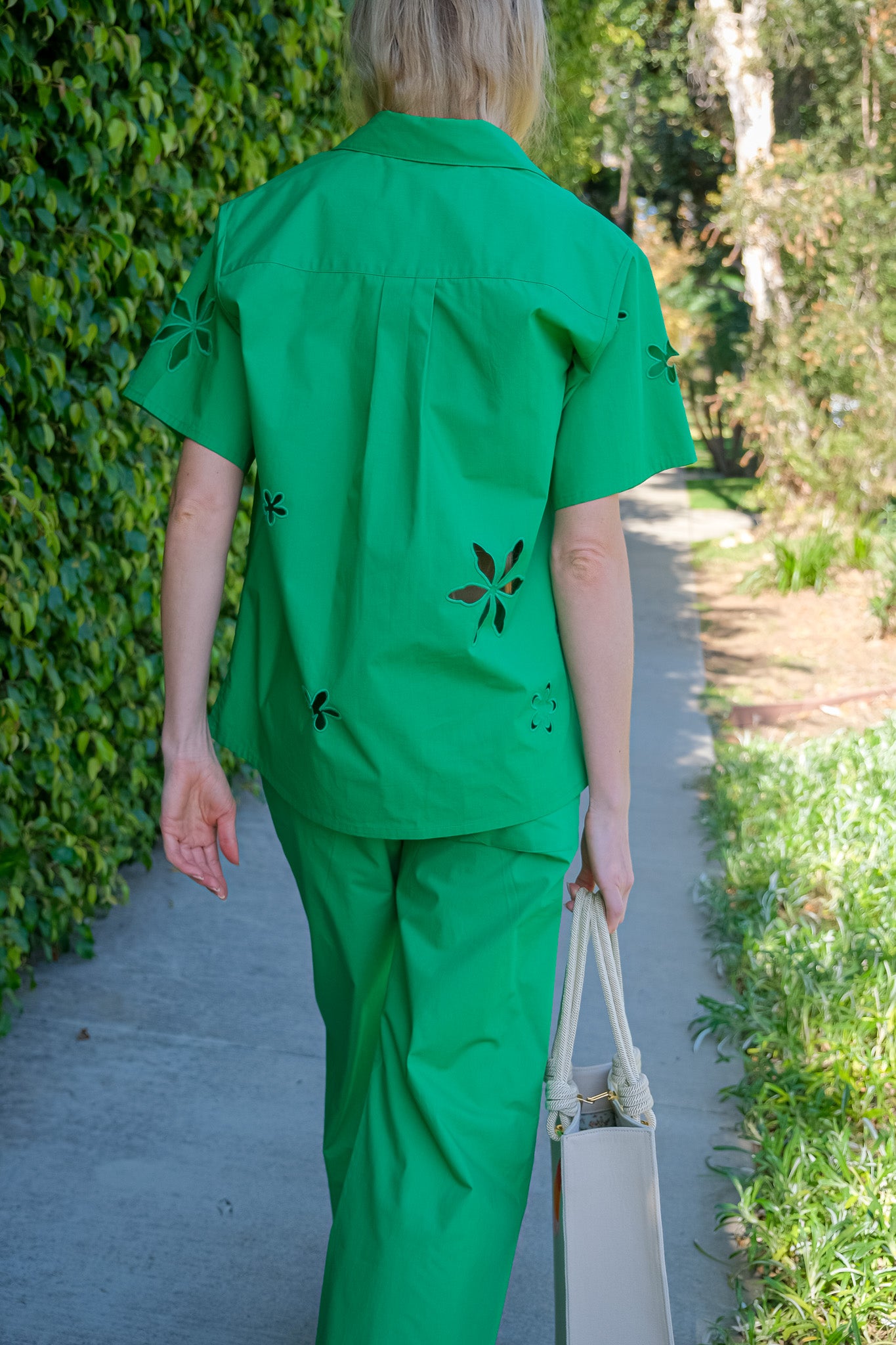  MIRA MIKATI |  EMBROIDERED CUTOUT SHIRT | Green floral motif cut out shirt | Relaxed silhouette | Classic collar neckline | Short sleeves | Hip length | Button-front | Composition: 100% Cotton | Dry Clean Only | Charlotte, NC