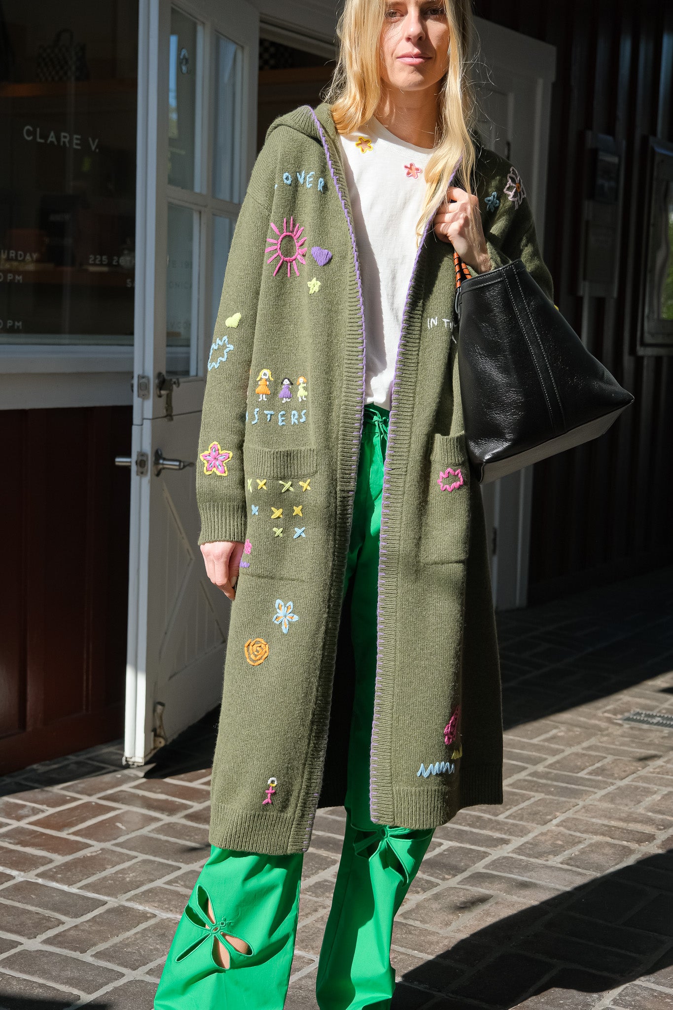 MIRA MIKATI | LONG DOODLE CARDIGAN | Long knit cardigan | Open front | Hooded | Front patch pockets | Multi-colored doodle embroidery throughout | Composition: 55% RWS wool, 25% recycled polyamide, 20% organic cotton | 
Care: Gentle hand wash or dry clean | Made in China | Charlotte, NC