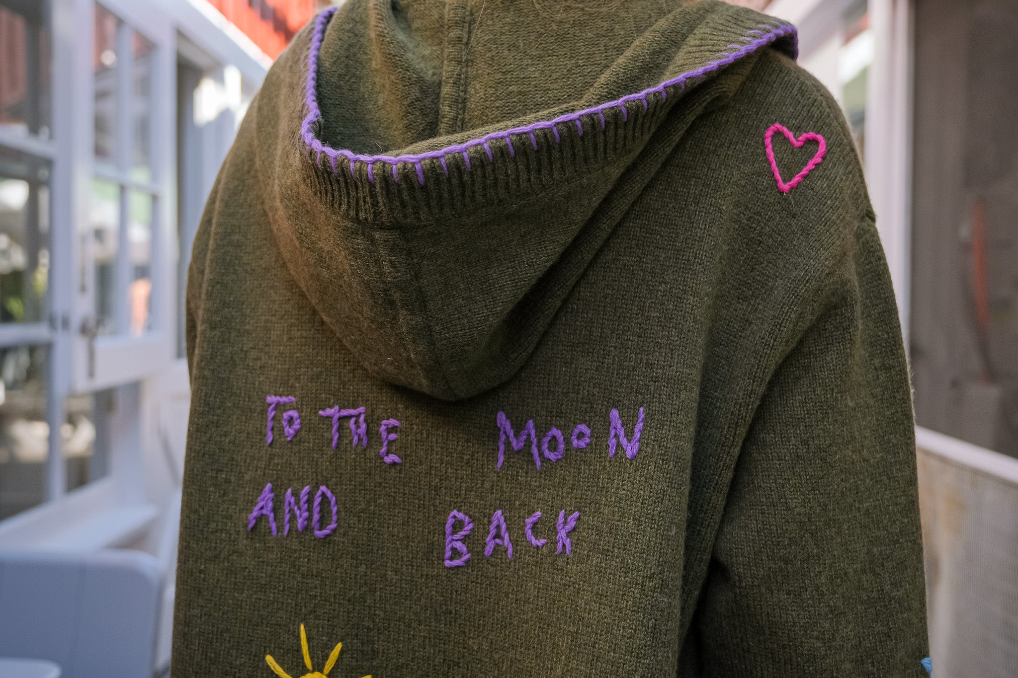 MIRA MIKATI | LONG DOODLE CARDIGAN | Long knit cardigan | Open front | Hooded | Front patch pockets | Multi-colored doodle embroidery throughout | Composition: 55% RWS wool, 25% recycled polyamide, 20% organic cotton | 
Care: Gentle hand wash or dry clean | Made in China | Charlotte, NC