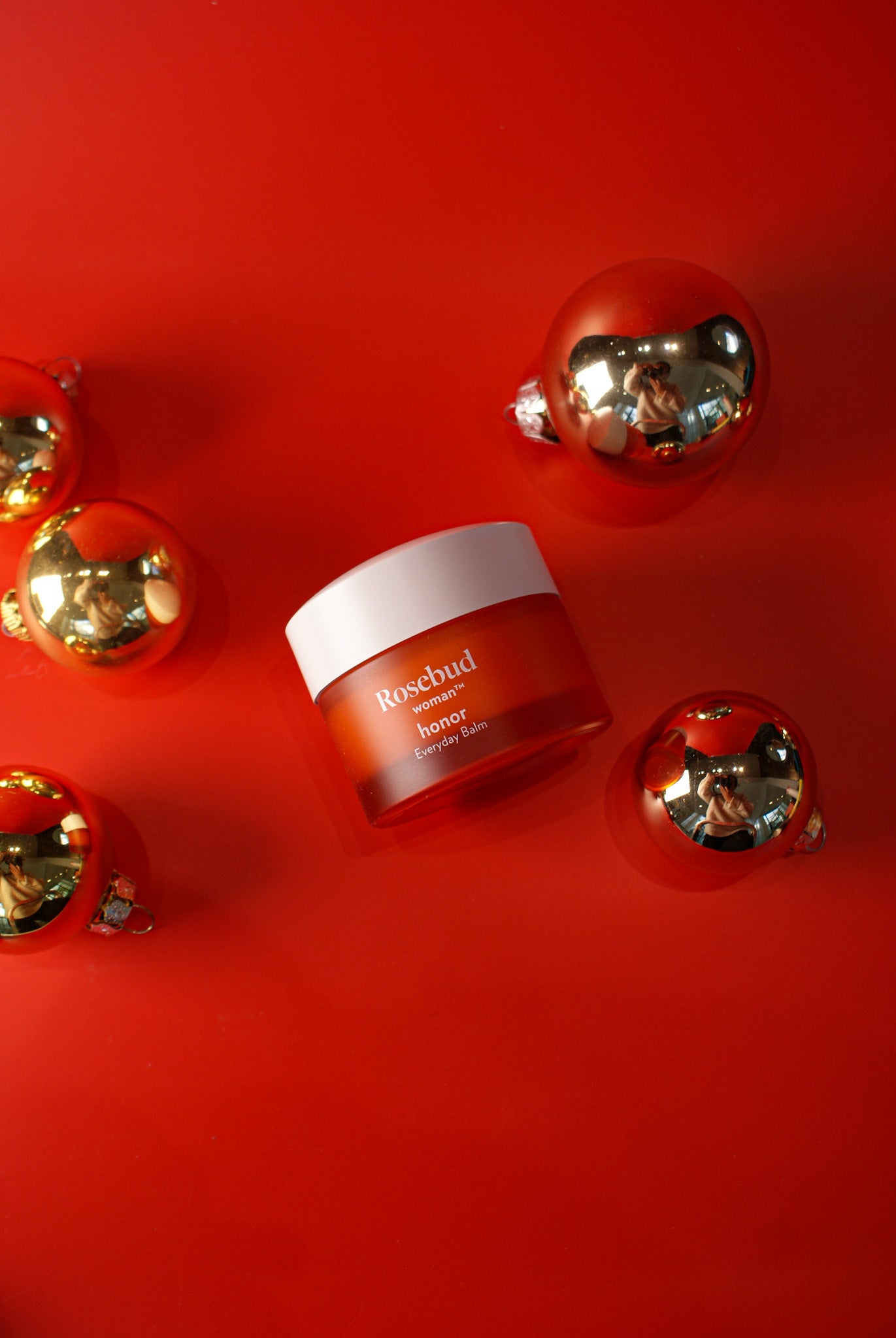 ROSEBUD | EVERYDAY BALM | Red jar with white top, on red background, Charlotte, NC